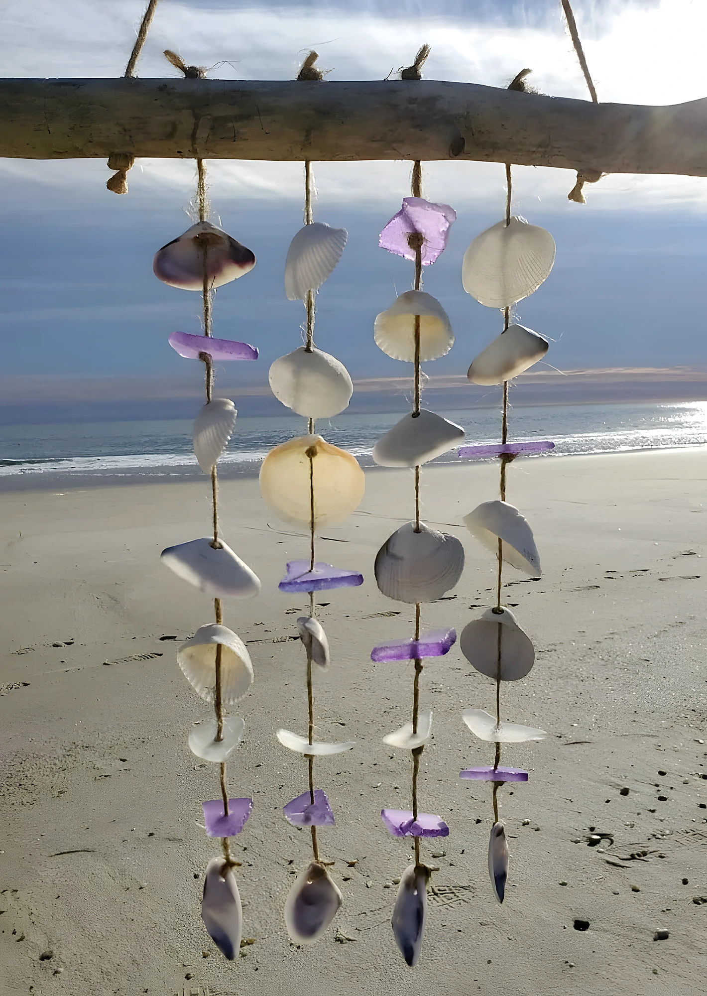 Lightweight shell wind chime on driftwood with tinted pieces and twine; easy-to-moderate craft.