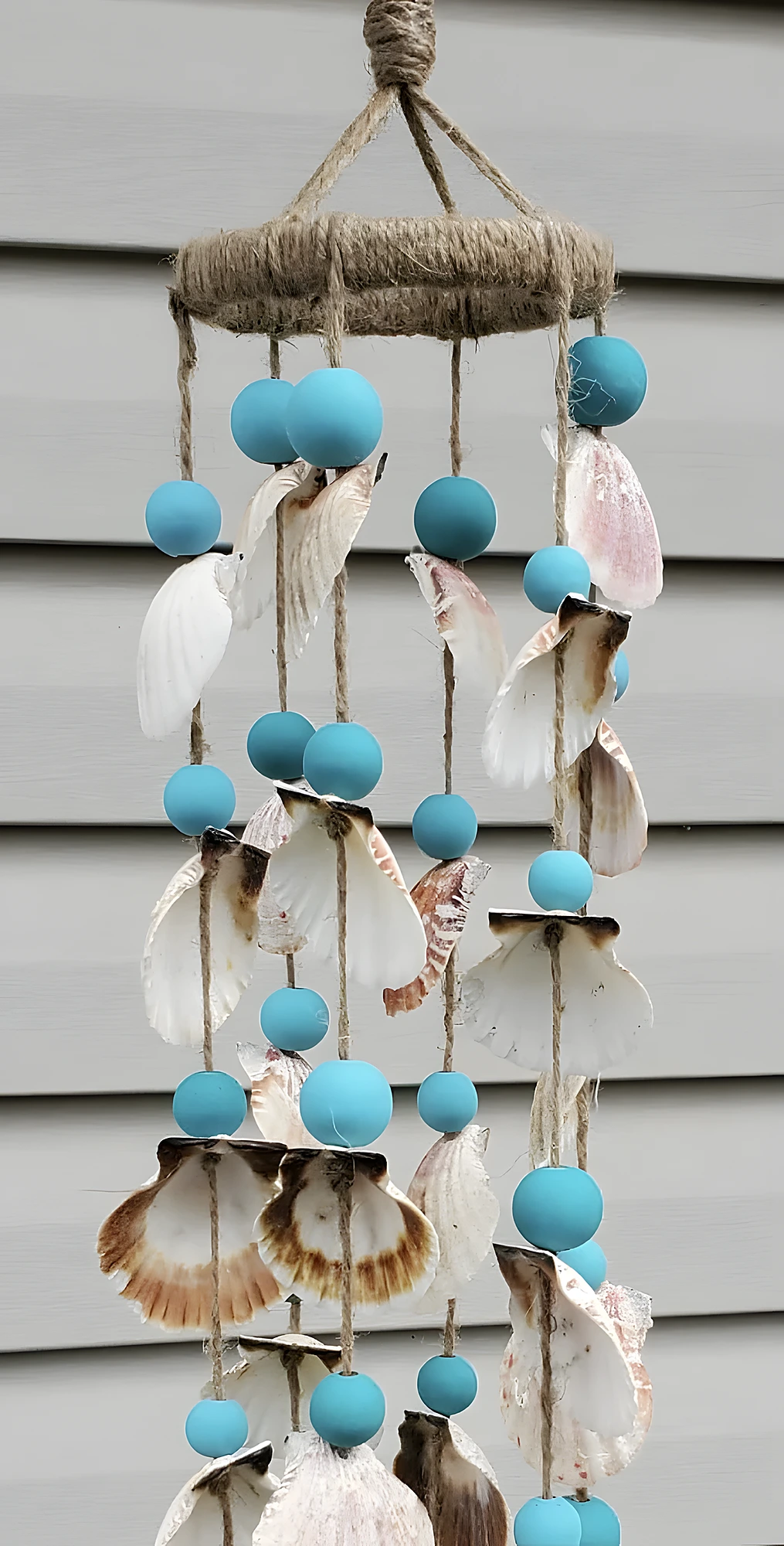 Coastal hanging craft with painted beads, natural shells, and jute cord; beginner to intermediate difficulty.